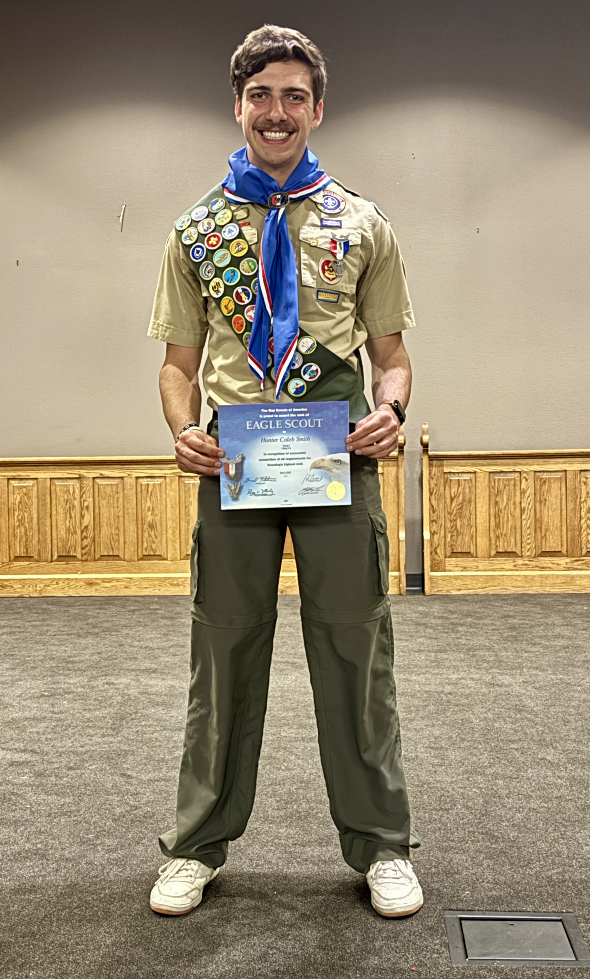 Hunter with Eagle Scout certificate