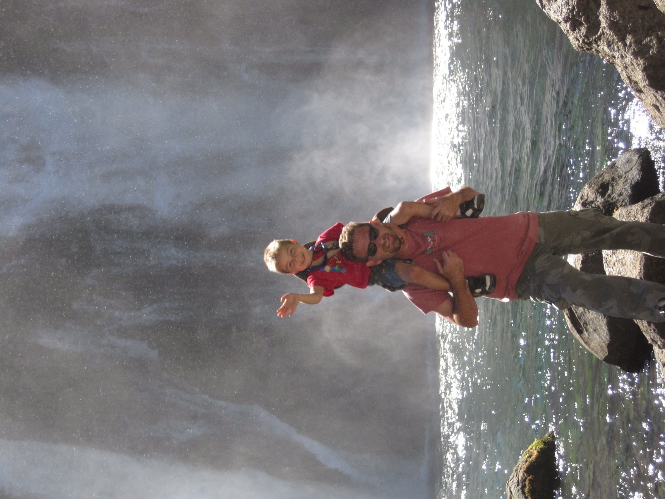 Young Hunter on dad's shoulders at waterfall